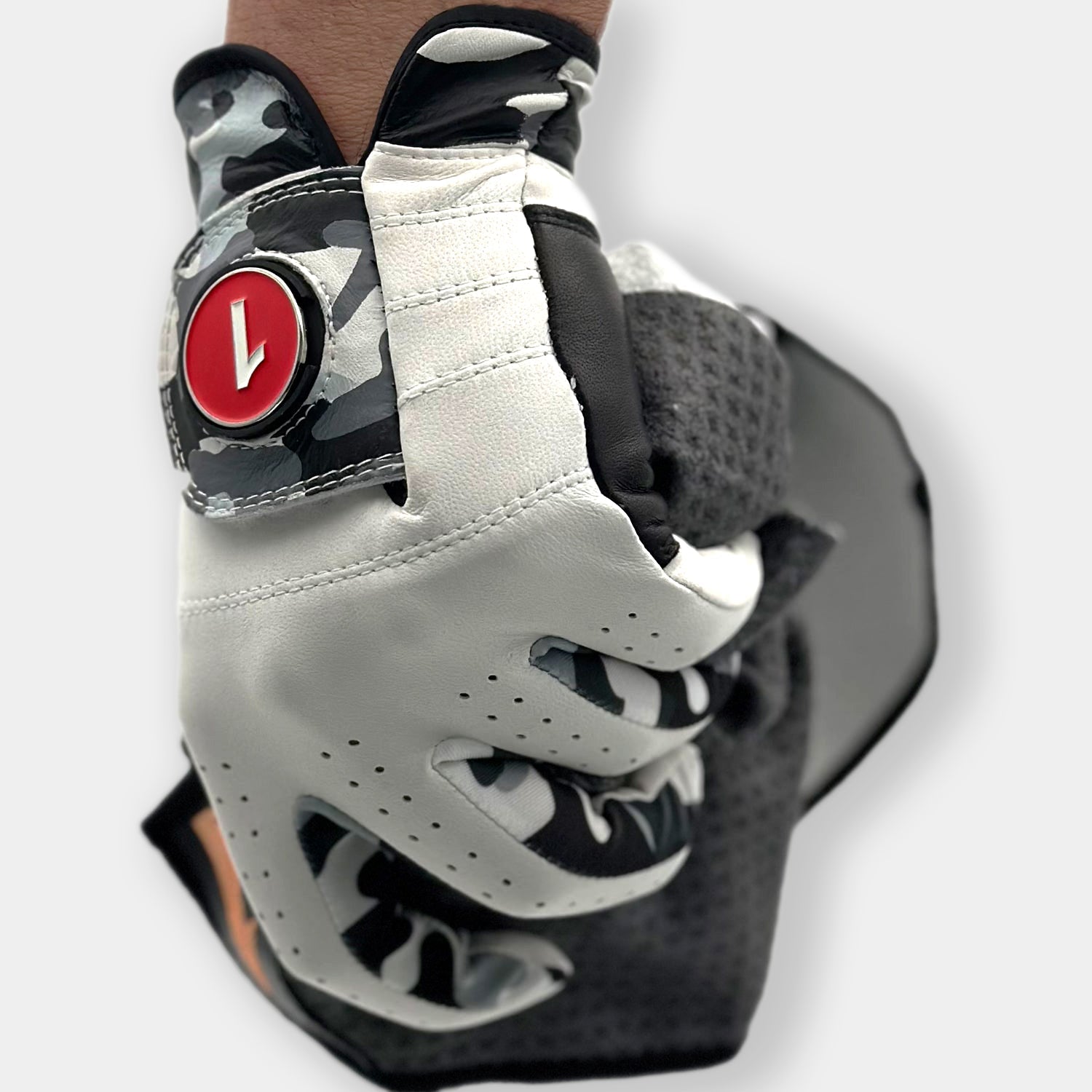 VivanTee Golf Gowanus Ghost camo golf glove holding a magnetic towel.