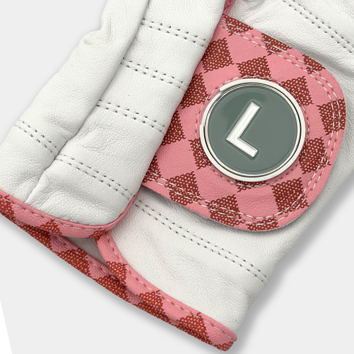 Men's pink checkered golf glove with "L train" magnetic ball marker by VivanTee Golf.